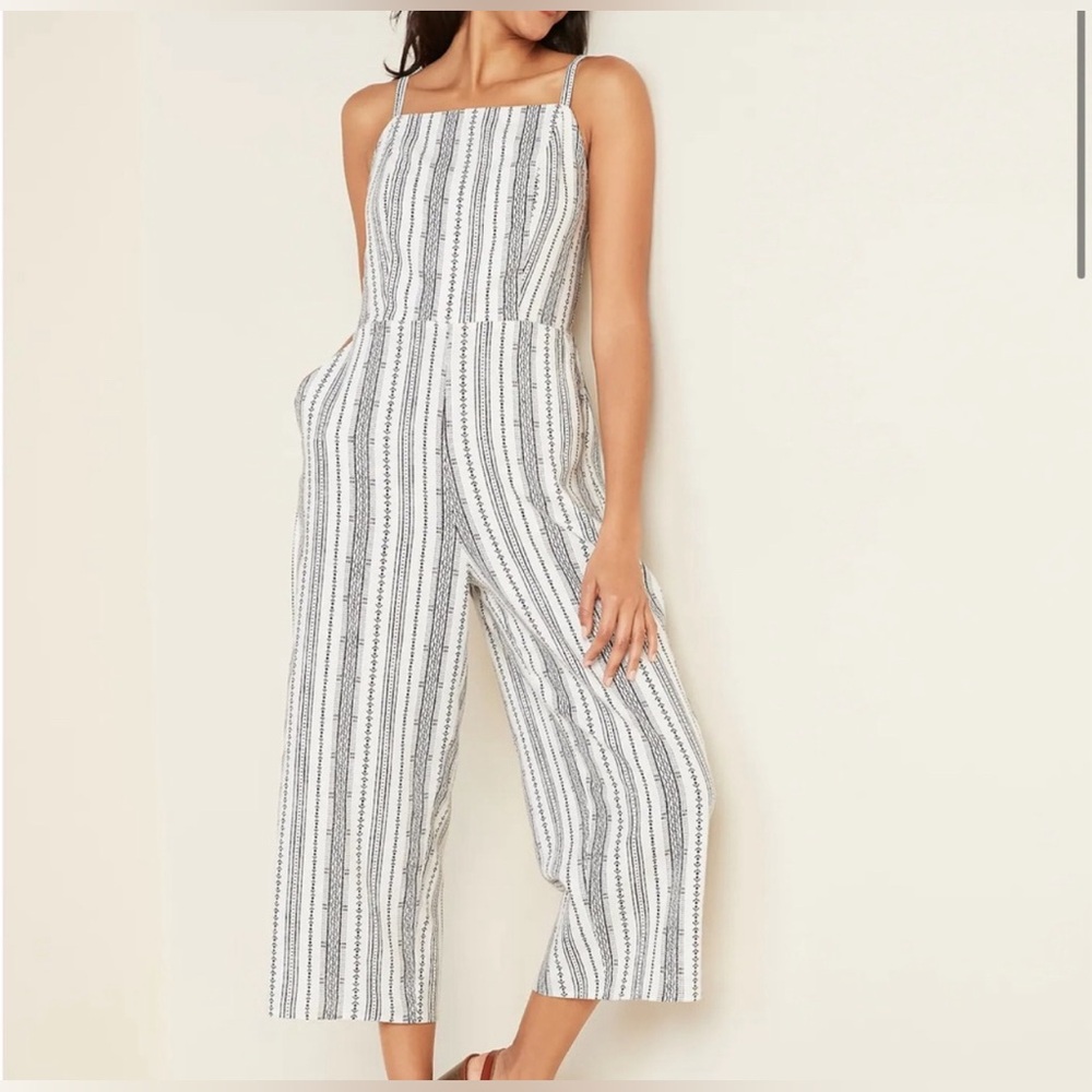 Old Navy, White Jumpsuit with a Black pattern, Size Large.